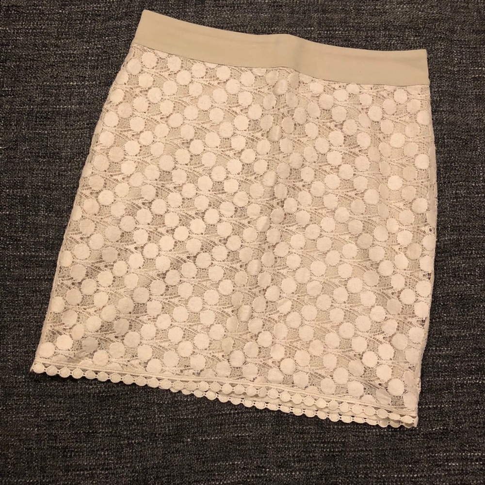 Off white lace mini skirt.
